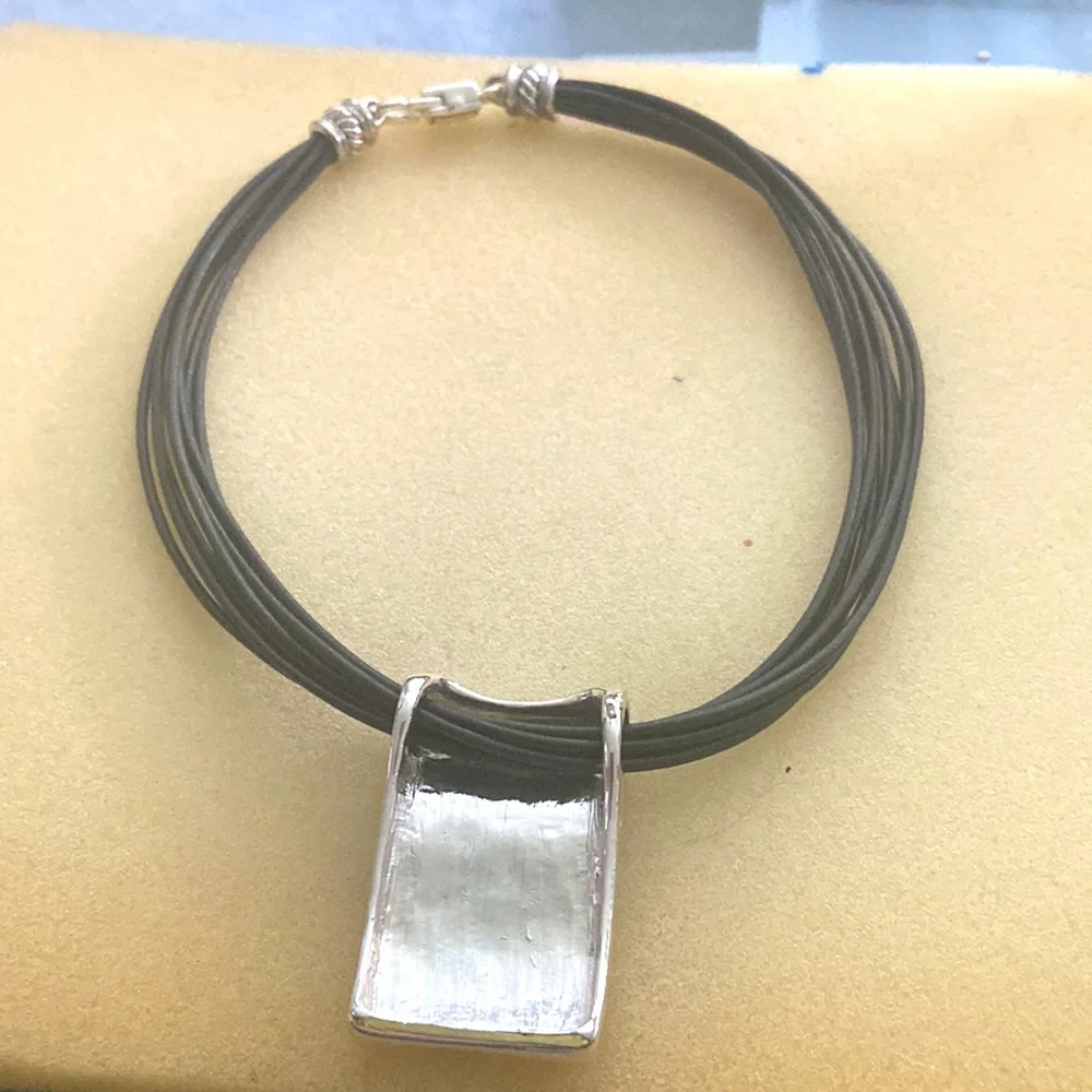 Corded necklace with silver tone piece - Picture 7 of 8